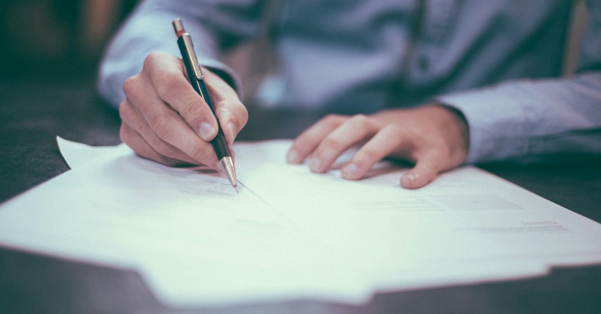 Investor reviewing financial documents and risk analysis